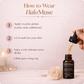 HaloMuse perfume oil with dropper and text on how to use it, featuring a candle and rose in the background.