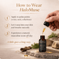 HaloMuse perfume oil bottle with dropper and usage instructions on a natural background